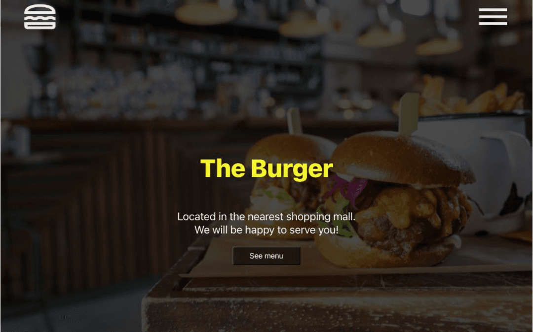 Image of the homepage of 'The Burger' website showing a fictional burger joint with a banner and navigation elements.